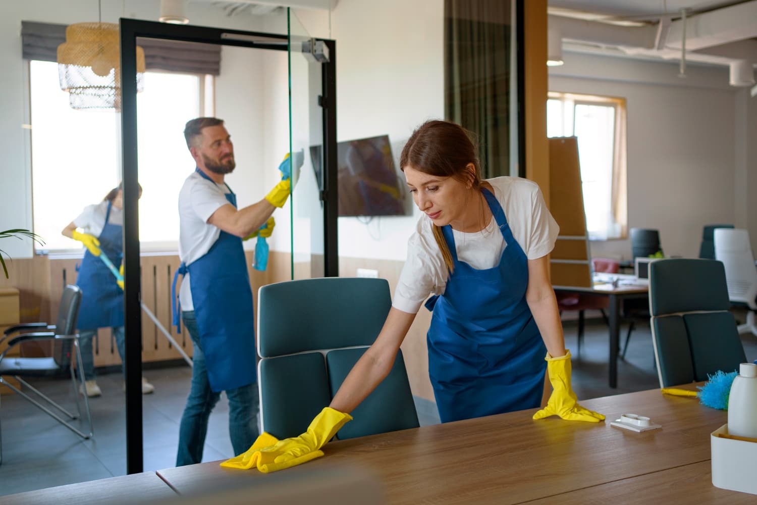 professional cleaning team cleaning a room